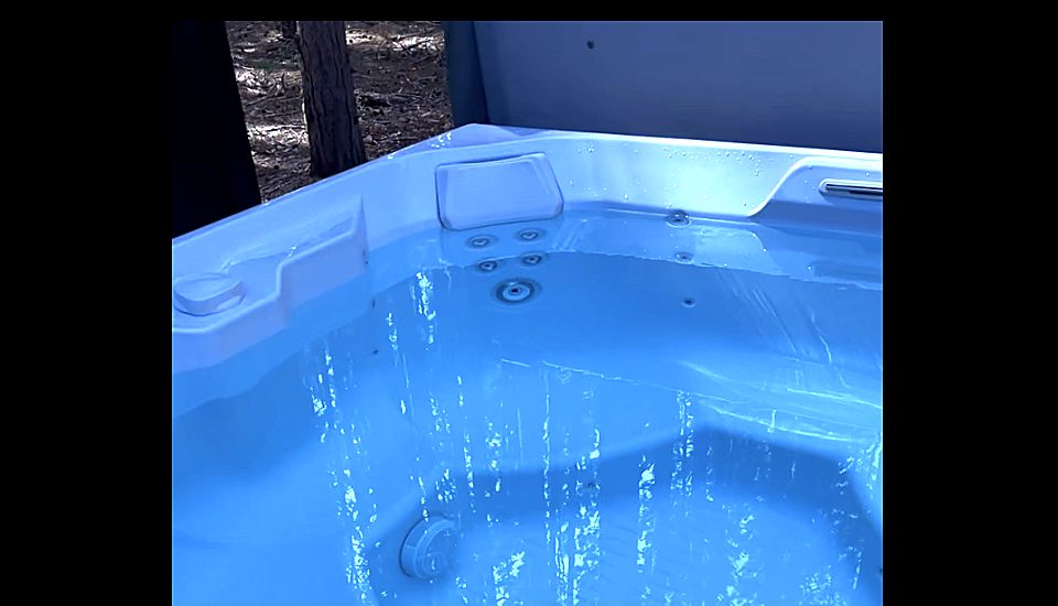 Hot tub jets running with clear, balanced water at a serviced vacation rental